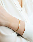 Caroline Ellen 18K Gold Oval Hinged Bangle with 18 Star-Set Diamonds